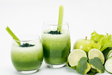green smoothies on white background