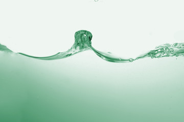 Water splash or water wave with bubbles of air on the background.