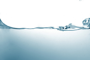 Water splash or water wave with bubbles of air on the background.