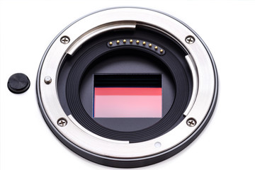 digital camera lens mount with sensor shown inside that is ready to be cleaned