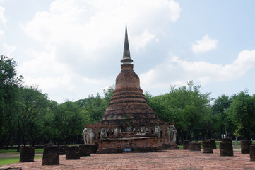Fototapeta premium elephant statues around old pagodas in the old city, sukhothai, world heritage, tourist attraction, thailand