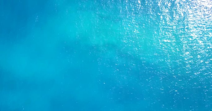 Blue minimalist sea texture with sunlight reflected on side, useful for hero header in homepage, vacation theme