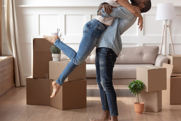 Happy husband lift kiss wife excited to move together - Powered by Adobe