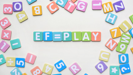 Multi-color Alphabet ABC letters and number and mathematics sign in square flat papers on white background with EF = PLAY at center.