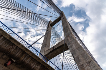 Modern suspension bridge. Detail of tower and steel cables. Barrios de Luna, Castile and Leon, Spain.