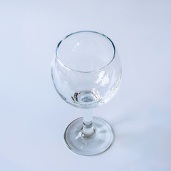 Empty wine glass on white background