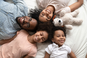 Top view portrait of happy black family with kids - Powered by Adobe