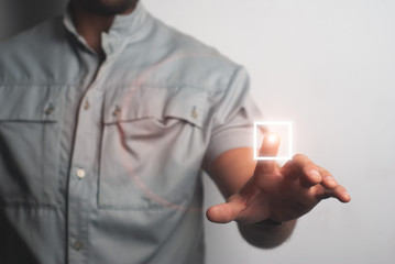 Man touching imaginary screen with his finger