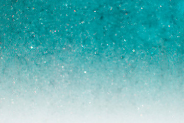 Blurred abstract blue glitter texture. Holiday christmas concept. Place for design.