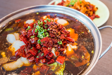Asia, China food. Szechuan water boiled spicy fresh fish. Fried Chicken side dish. Chengdu Chongqing hotpot food culinary.