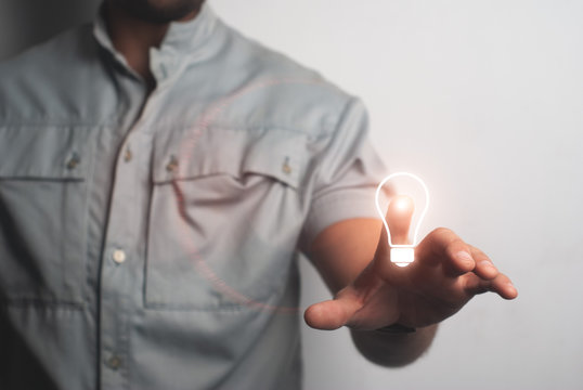Man touching imaginary screen with his finger. Creative idea concept,