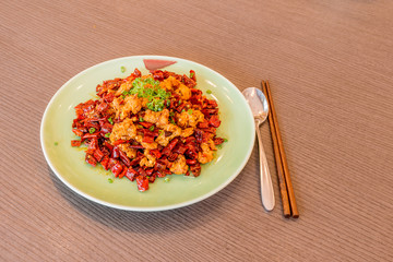 Sichuan Szechuan fried chicken with spicy red hot chillies. Asia China Chinese food cuisine. Chengdu Chongqing culinary.
