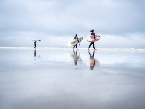 Surfers on a cloudy day