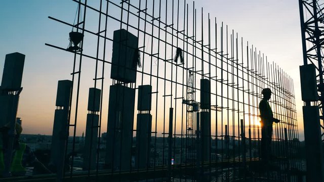 Floor foundation of a high-rise building is being made by workers