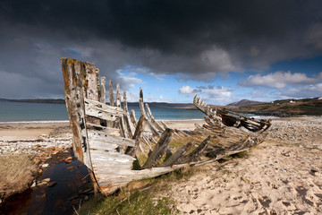 The remains of an old fishing vessel at Melness beach