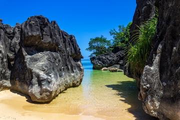 Large limestone rocks on Bagieng Island beach in the municipality of Caramoan, Camarines Sur Province, Luzon in the Philippines, region for Survivor TV shows filming.