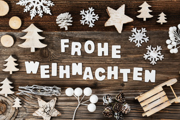 White Letters Building The Word Frohe Weihnachten Means Merry Christmas. Wooden Christmas Decoration Like Sled And Tree And Star. Brown Wooden Background