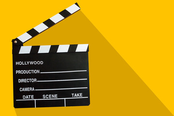 Film clapper board icon on yellow background with shadow. Blank movie clapper cinema illustration