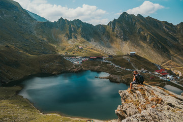 Photographer takes the picture Panorama from 2000 meters altitude where you can see Bâlea Lac, Bâlea Lac chalet and Transfăgărășan road.