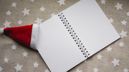 Notebook to write goals of new year on christmas background