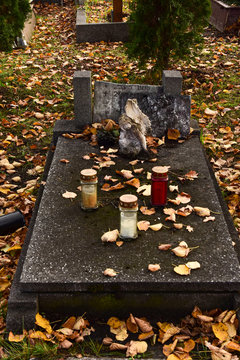 Old, destroyed abandoned graves on a wet November day.