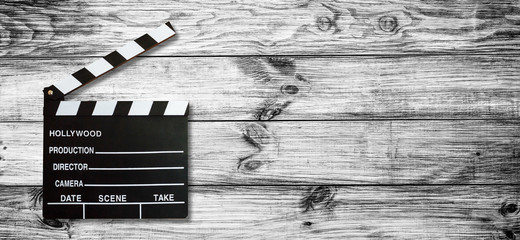 Movie clapper board on wooden background