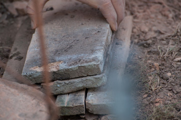 Worker cutting a tile using an angle grinder.Construction tool