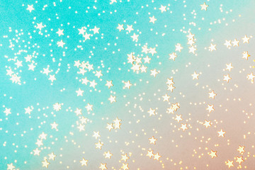 Trendy coral and blue background with golden stars. The concept of celebrations, the Day of St. Valentine, Christmas, New Year, holiday, birthday, etc.