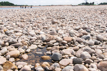 Stone on the lake after waterfall