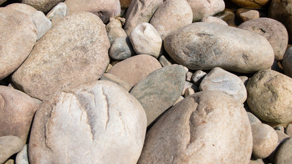 Stone on the lake after waterfall