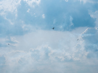 airplane flying in the sky with clouds
