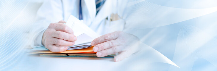 Doctor looking for a file; panoramic banner