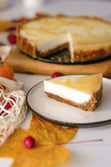 pumpkin cheesecake with persimmon. autumn concept.