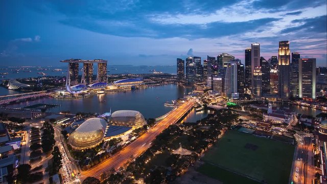 Singapore business district and city - Time lapse from sunset to night