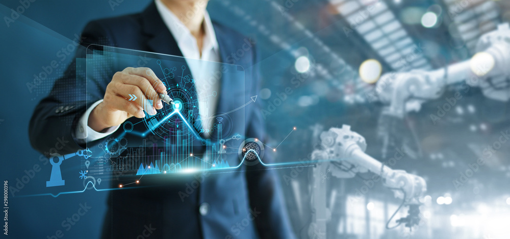 Poster Manager engineer analyzing and control automation robot arms machine on software modern virtual interface data real time  in intelligent factory industrial and digital manufacturing operation.