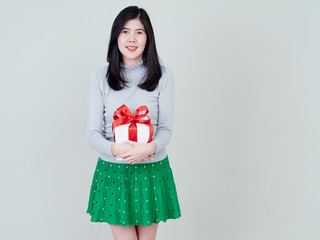 Fototapeta premium Beautiful woman holding gift box red ribbon