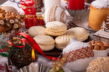 Traditional Christmas cookies biscuits Melting Moments and panforte on Christmas table. Christmas New Year ornament decorations.