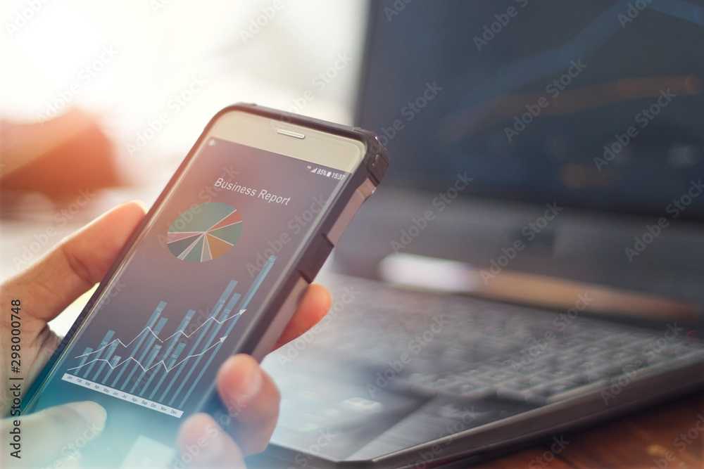 Poster businessman using mobile smartphone analyzing sales data and economic growth graph chart. business s