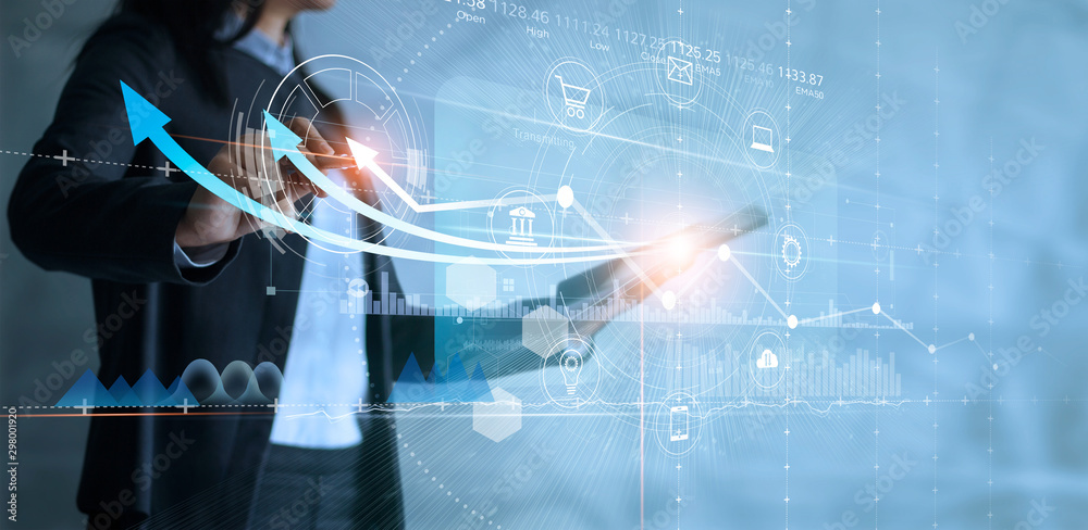 Leinwandbilder Business woman using tablet analyzing sales data and drawing growth graph with icon customer network connection on virtual interface, Business strategy, Digital marketing.