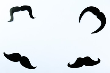 Obraz premium Concept for annual event involving growing of moustache & beard during month in November to raise awareness of men health issues and prostate cancer. Background, close up, copy space, flat lay.