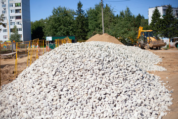 Construction site for building a building. Building materials sand and stone. Preparation of the construction site.