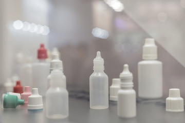Lots of plastic bottles for drugs and chemicals. Plastic dropper bottles.