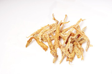 Fried crispy salted fish isolated white background