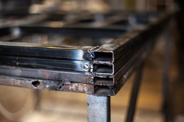 Metallic profile. Cut metal. Materials in the workshop to create designs.