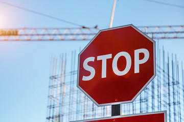 Stop Sign And Blue Sky.Work in progress. Roadworks, road signs. Men at work. Some signs signage for...