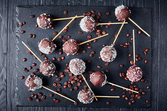 chocolate cake pops on a black tray