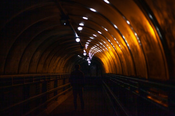 Tunnel at night. Light in a spiral. Night crossing over the road.