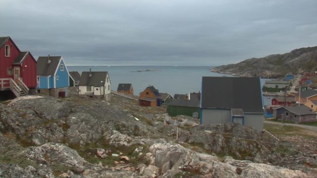 Arsuk, village in Greenland. Close to the centrum of Arsuk, Panning of the centrum and the fjord across Arsuk. Filmed in 2008 july 15.