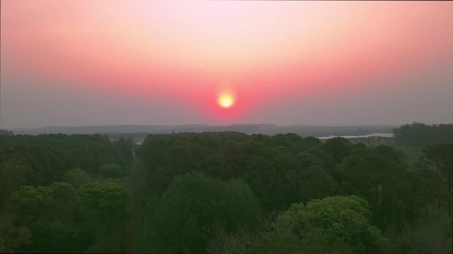 Cerro Verde, Corrientes province, Argentina. Drone Footage reveal sunset, lots of pink and gold. Afternoon. Forest, trees and nature.