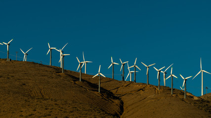 Windmills on top of a hillside